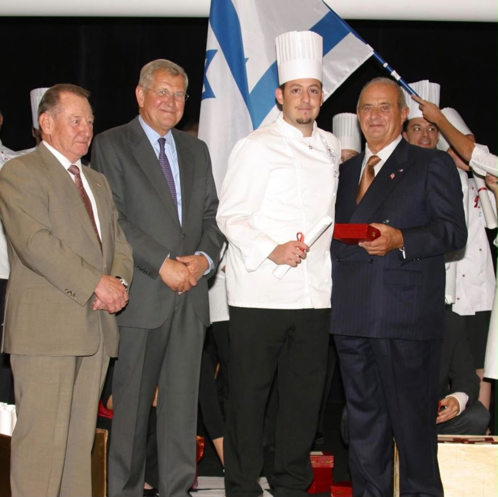 Chef Kfir receiving his diploma from Chef Paul Bocuse