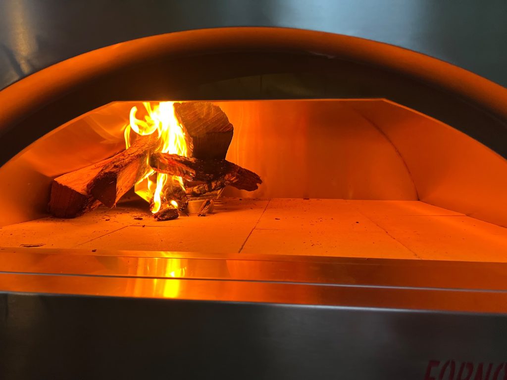 Fire burning inside Chef Kfir's woodfire taboon